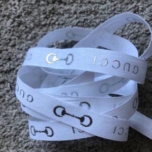 Authentic Gucci White Ribbon With Silver Gucci Logo. 184 cm.